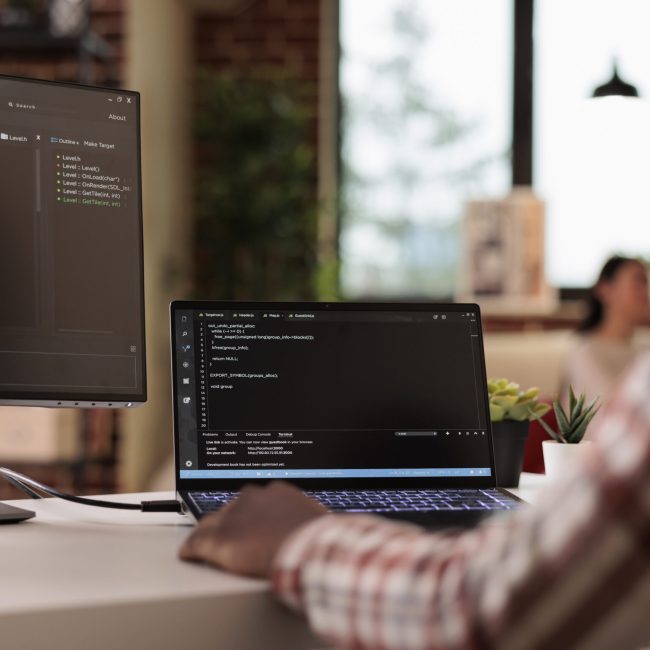 software-developer-programming-firewall-security-multiple-monitors-learning-new-user-interface-developing-application-cloud-server-with-binary-code-html-script-terminal-window-scaled.jpg